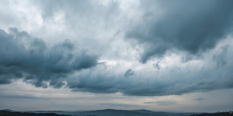 Obraz premium Dramatic Overcast Sky Landscape with Dark Clouds and Open Space for Text and Design Elements in a Serene Natural Setting