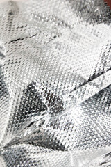 Industrial foil shiny background with rivets and crumpled lines