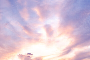 Breathtaking Sky at Dusk. Stunning Mix of Pink, Lilac, and Golden Clouds Against a Blue Backdrop