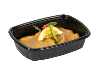 A black container of food with a slice of lemon on top