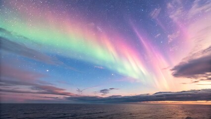 Fototapeta premium A breathtaking display of the Aurora Borealis paints the night sky with vibrant green and pink hues over a dark landscape
