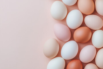 Natural colored eggs forming a border on pink background