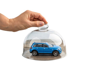 A blue toy SUV under a glass dome, highlighting the concept of protection, ownership, and auto insurance coverage, isolated on a transparent background