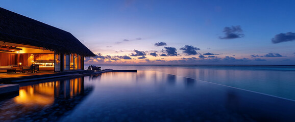 Obraz premium A luxury overwater bungalow with an infinity pool at twilight, overlooking the tranquil ocean and reflecting the soft hues of the evening sky, symbolizing a serene vacation getaway.