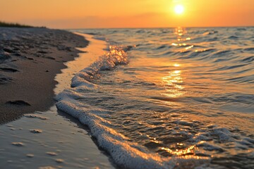 Golden Hour Sunset on Sandy Beach with Gentle Ocean Waves
