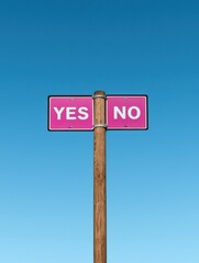 Decision signpost yes or no options outdoor setting symbolic image clear sky perspective on choices