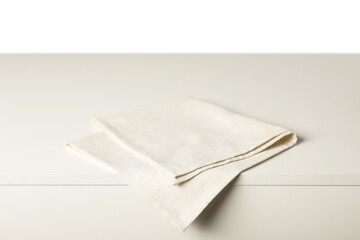 Napkin on light table against white background