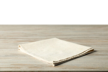 Light napkin on wooden table against white background
