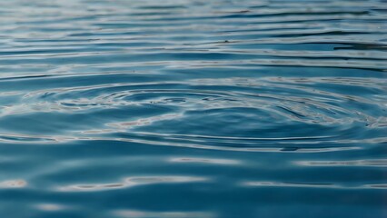 Calm Blue Water Surface with Gentle Ripples - Serene Ocean or Lake Background