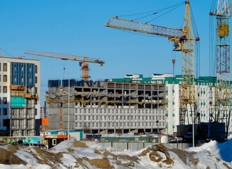 Modern apartment buildings under construction. Architectural background. Construction crane. Contemporary architecture. Construction concept. Ust-Kamenogorsk (kazakhstan)