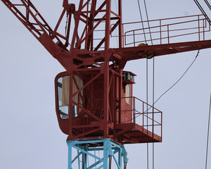 Сonstruction tower crane against blue sky. Construction site. Architectural concept. Industry. Ust-Kamenogorsk (kazakhstan)