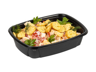 A black container filled with food on a white background