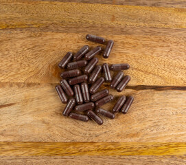 Iron capsule, Fe pills, dark red hemoglobin supplement tablets, vitamin capsules, mineral