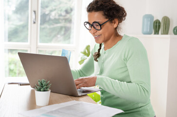 Black woman is shopping online from home