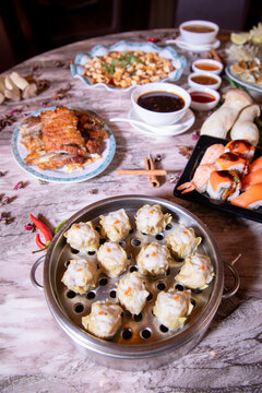 Gourmet Asian Food Platter Featuring Hot and Sour Soup, Dumplings, and Tofu