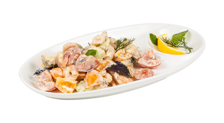 A white plate topped with a vibrant salad and fresh lemon slice