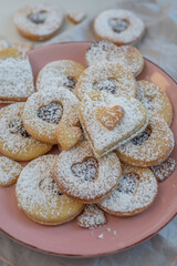 Linzer cookies with heart with raspberry jam 