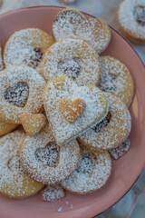 Linzer cookies with heart with raspberry jam 