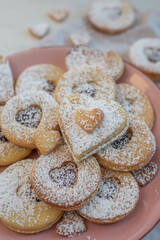 Linzer cookies with heart with raspberry jam 