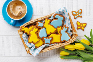 Easter Bunny-Shaped Gingerbread Cookies, Yellow Tulips, and Coffee Cup