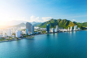Beach overlooking panorama aerial view city on the coast of Southeast Asia in the evening at dawn sunrise Nha Trang © aapsky