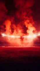 Soccer stadium illuminated by red light and smoke at night