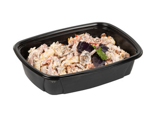 A black plastic container with salad on a white background