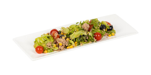 A salad with tuna, lettuce, tomatoes, and olives on a plate