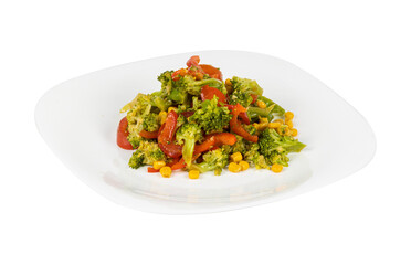 A white plate with broccoli, corn, and tomatoes on a white bg