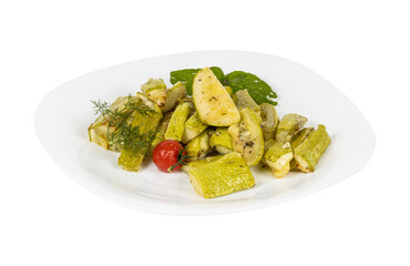 A white plate with vegetables and a tomato on a white background
