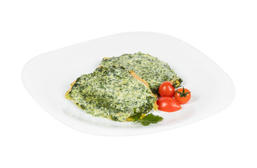 A white plate with spinach and tomatoes on a white background