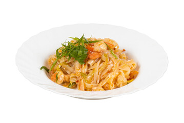 A white plate with noodles and vegetables on a white background