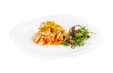 A white plate with salad and vegetables on a white background