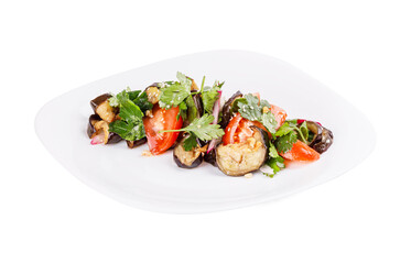 A white plate topped with a variety of vegetables on white