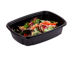 A black container with salad on a white background