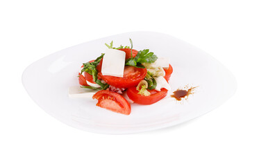 A white plate with tomatoes and cheese on a white background