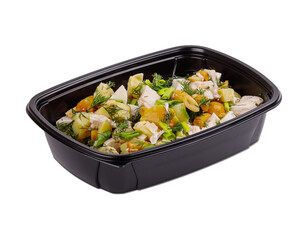 A black plastic container that is filled with food on a white background