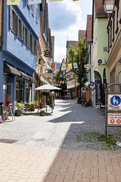 Oehringen, Germany July 20 2023: City center of Oehringen festively decorated with shops and cafes