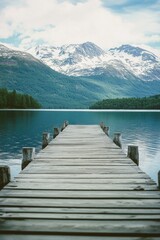 Fototapeta premium Lake shore pier with mountain view