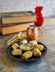 sausage rolls served with mustard dipping sauce