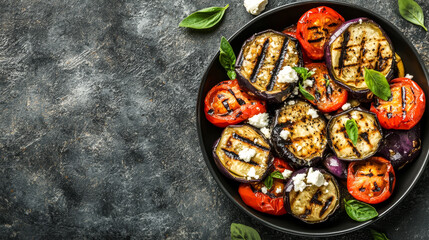 A nutritious vegetarian dish consisting of grilled eggplants, tomatoes, and feta cheese,...