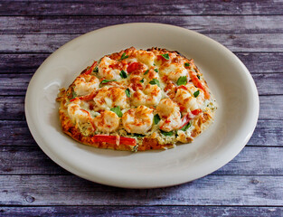 naan 'pizza' topped with sautéed shrimp and ricotta sauce