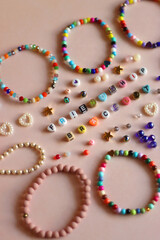 Friendship bracelet spelled with letter beads. Colorful handmade bracelets and various beads....
