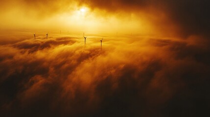 Aerial view of offshore wind farm at sunrise, turbines emerging from ocean mist, golden light reflecting on blades