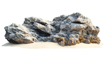 Weathered rock formation displaying rough textures, sitting atop pale sandy surface, removed from background