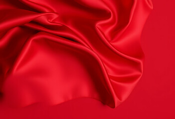 Obraz premium Elegant Crimson Red Silk Fabric Flowing with Graceful Folds and Textures 