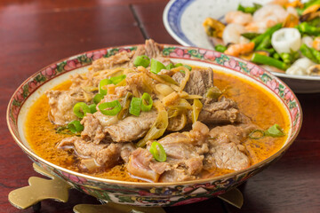 Chinese steamed pork ribs with spring onions in broth