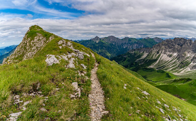 Breitenberg mountain ridge panorama in Allgau region with hiking trail in summer