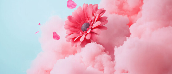 Fototapeta premium vibrant pink flower surrounded by soft pink clouds creates dreamy atmosphere. Perfect for spring themes and floral designs
