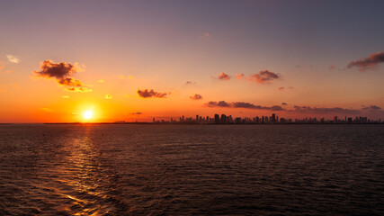 Beautiful skyline of Miami in Florida during sunset with purple clouds